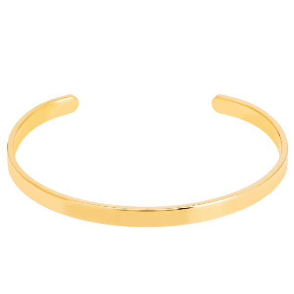Złota, minimalistyczna bransoletka mankietowa.