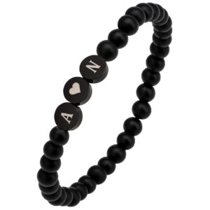 ARMBAND MIT SCHWARZEN PUNKTEN