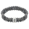 Bransoletka z szarych, marmurkowych koralików z metalowym zapięciem.