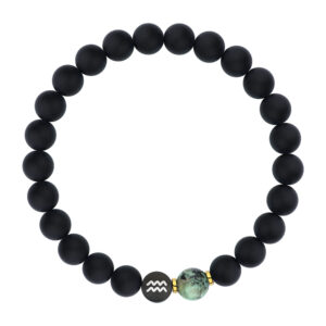 Czarna bransoletka z kulkami i zielonym koralikiem.