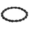 Czarna bransoletka z koralików o teksturze lawowej i geometrycznych elementach.