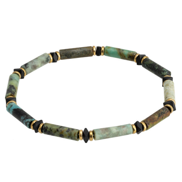 Bransoletka z cylindrycznymi kamieniami w różnych odcieniach zieleni z czarnymi i złotymi akcentami.