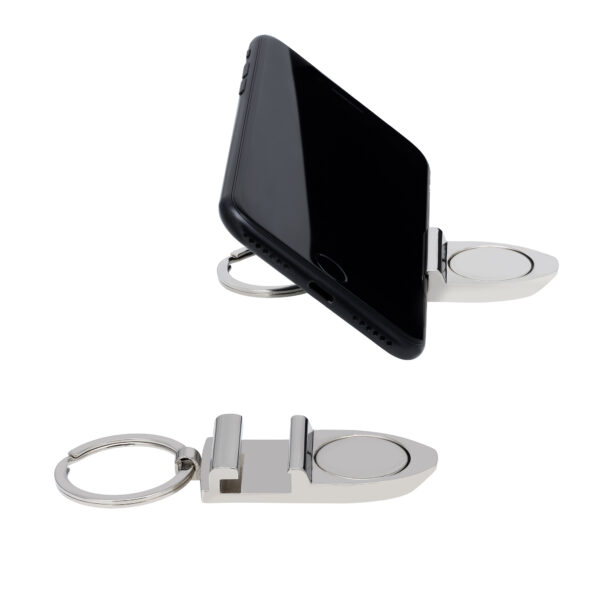 Brelok z uchwytem na telefon, ustawiony na płasko i z telefonem.